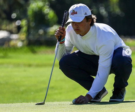 Pierce Isaac lines up a putt.